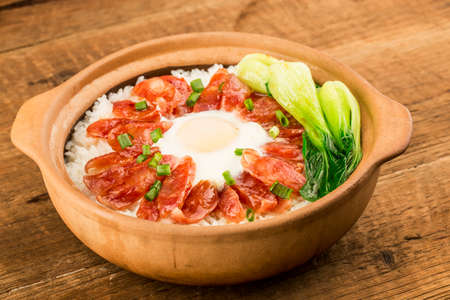 Cantonese style cooking of claypot rice with waxed meatsの写真素材