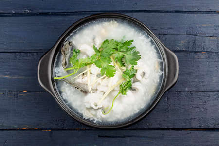 Chinese cuisine; Congee with fish slices in casserole