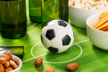 Watch football live, prepare beer and snacks