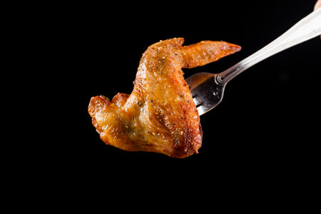 A plate of delicious roasted chicken wingsの写真素材