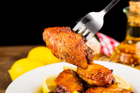 A plate of freshly baked chicken wingsの写真素材