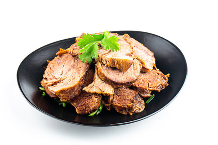 roast beef on plate isolated on white backgroundの写真素材