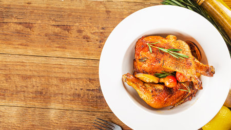 Homemade roasted chicken legs with Rosemaryの写真素材