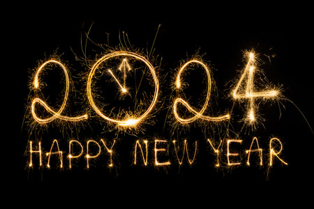 Happy New Year 2024. Sparkling burning text Happy New Year 2024 isolated on black background.の写真素材