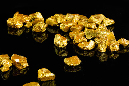 Gold nugget on black background. Golden nugget.