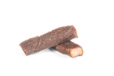 Piece of beef jerky isolated on white background with clipping pathの写真素材