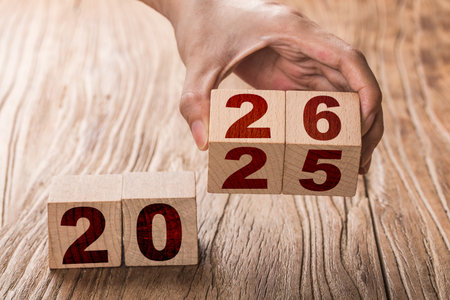 Wooden cube with number 2026 on wooden background, new year conceptの写真素材