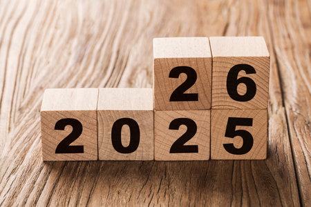 Wooden cubes with numbers 2020 on a wooden background.