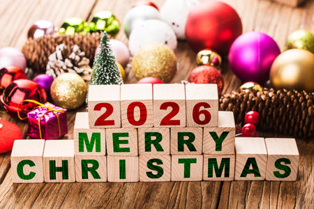 Wooden blocks with Merry Christmas and Happy New Year concept on wooden backgroundの写真素材