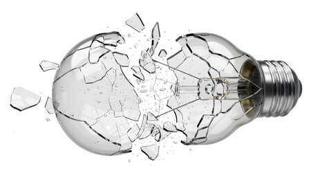 A clear glass incandescent light bulb is exploding with many sharp fragments flying outwards...