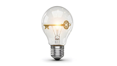 Bulb showing illuminated golden key inside clear light bulb with glowing filament on white.