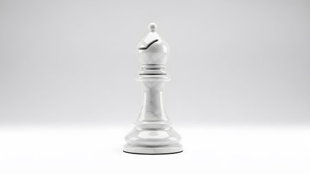 Soft showing white marble chess bishop piece on a white studio background with soft lighting.の写真素材
