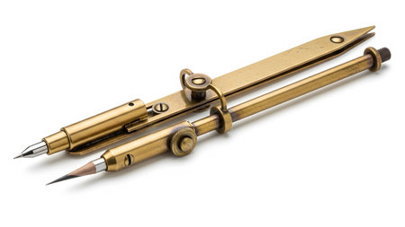 Background showing antique brass compass and divider set with pencil on white background.