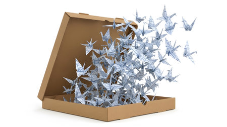 Cranes showing many white and blue patterned origami cranes escaping from an open cardboard box....