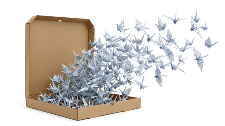 Cranes showing origami paper cranes flying out of an open cardboard box on a white background....