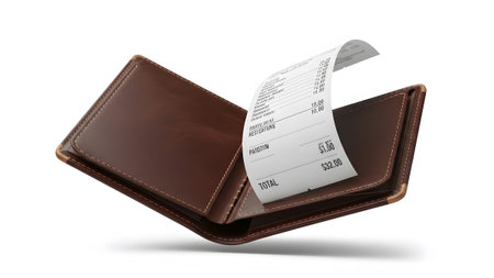 A brown leather wallet is open, displaying a white paper receipt with printed text and monetary...