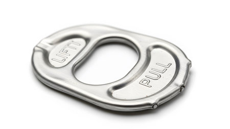 A metallic aluminum pull tab from a beverage can, featuring LIFT and PULL text, is shown on a...