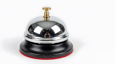 Ring showing chrome bell with black base and red felt ring on white background.