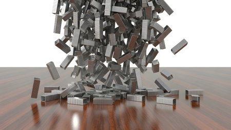 Wooden showing heap of metal staples falling onto a polished wooden surface. resolution...