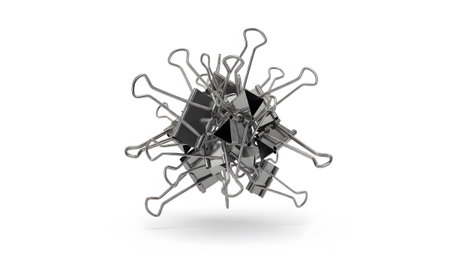 Forming showing clustered pile of black binder clips forming a spherical shape on a white...