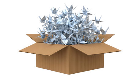 Creativity showing open cardboard box filled to the brim with origami paper cranes spilling out...