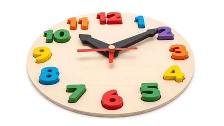 A light wood round clock brightly colored wooden numbers and black hour and minute hands.
