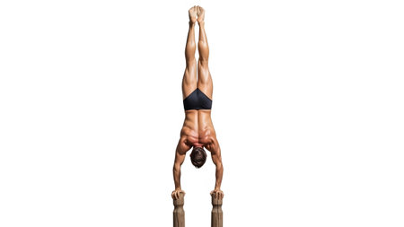 Handstand showing man performing a handstand on wooden blocks with white background.