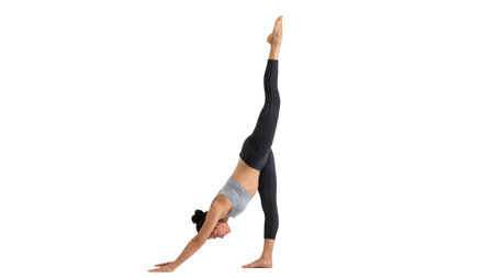 A woman with dark hair in a ponytail is in a modified downward-facing dog pose with her right...