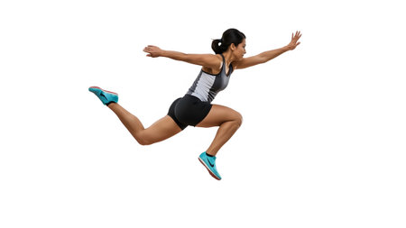 A woman in athletic wear is captured mid-air, arms extended, on a white background....