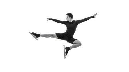 Mid-air showing black and white of a male ice skater in mid-air jump on white background.の写真素材