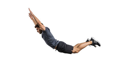 T-shirt showing athletic man in dark grey t-shirt and black shorts in flying pose with arms...の写真素材