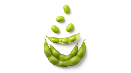 Smiling showing edamame beans arranged in a smiling face on a white background. resolution...