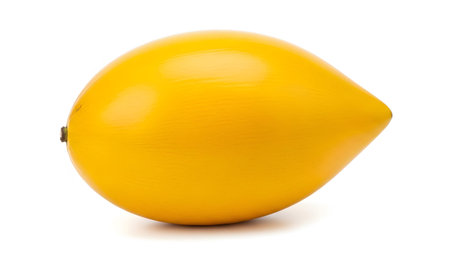 Ripe showing single ripe yellow lucuma fruit with smooth skin on a white backgroundの写真素材