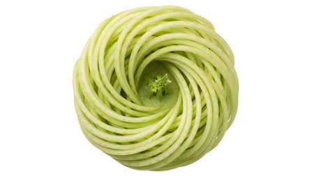 A light green vegetable is intricately spiral cut and viewed from directly above on a white...