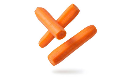 Three peeled bright orange carrots are arranged in a floating X shape against a clean white...の写真素材