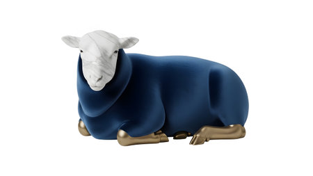 A decorative sheep sculpture with a navy blue velvet body, marble head, and gold legs rests on...の写真素材