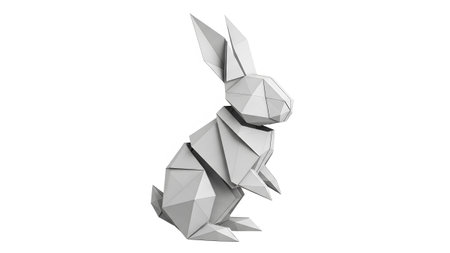 Background showing low poly white origami rabbit in a sitting pose on a white background.の写真素材