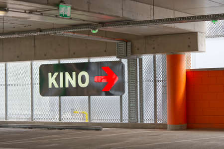 Cinema Sign in parking place in Estonian shopping center. Kino