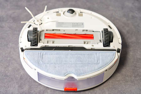 Tallinn, Estonia - October 10, 2021: Xiomi s7 roborock vacuum cleaner technical details. View from below. Brushes, wheels and sensors. close upのeditorial素材