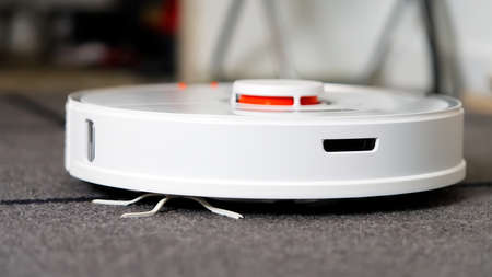 Tallinn, Estonia - October 10, 2021: Xiomi s7 roborock vacuum cleaner performs automatic cleaning of the apartment. close upのeditorial素材