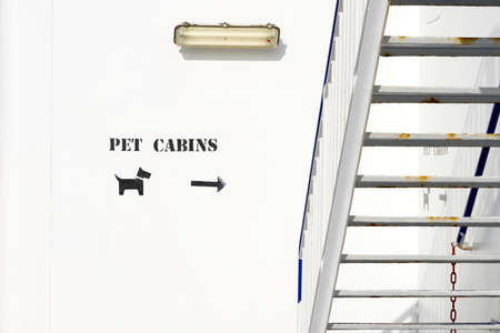 houses for pets sign on the ship. Pet Cabins on the Ferry