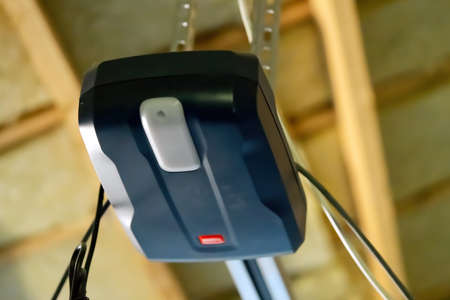 automatic garage door opener electric engine gear mounted on ceiling. close upの写真素材