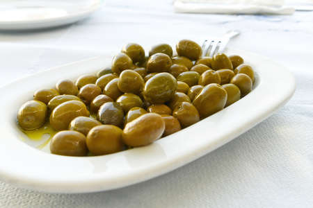 green olives in a greece restaurant. close upの写真素材