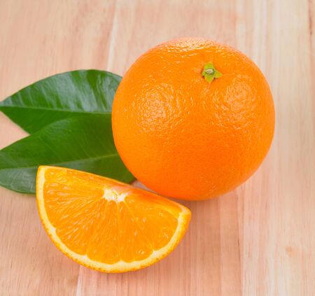 Orange  fruit  on wood backgroundの写真素材