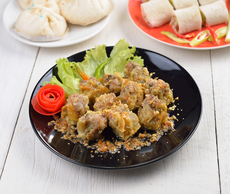Dumplings  for appetizer on black plateの写真素材