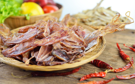 dried squid on wood background