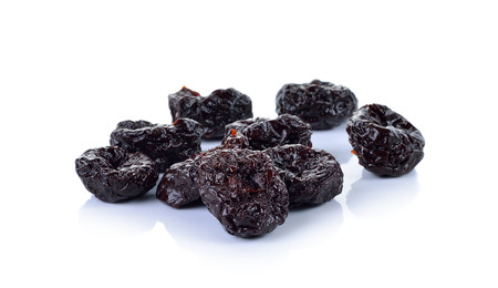 Dried Prunes on  white backgroundの写真素材