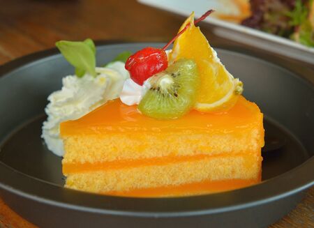 Orange cake  on wooden background