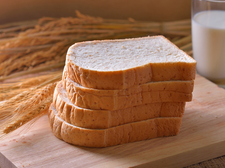 bread and wheat on the wooden