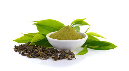 powder green tea and green tea leaf  on white backgroundの写真素材